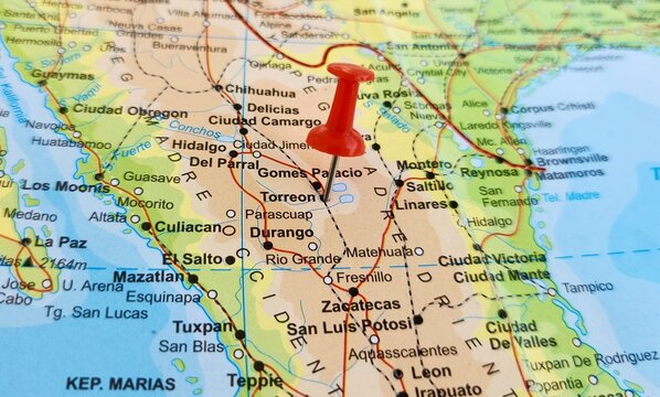 View of Torreon, is a city and seat of Torreon Municipality in the Mexican state of Coahuila, on a geographical map of America, marked with red push pin