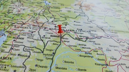 Naklejka premium View of Bangui, is the capital and largest city of the Central African Republic, on a geographical map of Africa, marked with red push pin