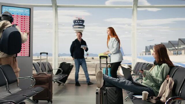 Remote worker react to postponed flights and shutdown conditions, staring at cancellation notice in crowded airport lounge. Diverse travelers illustrating upset emotions and panic.