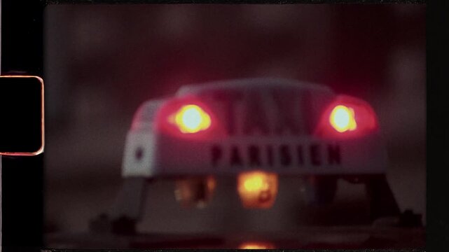 Parisian taxi sign illuminated at night