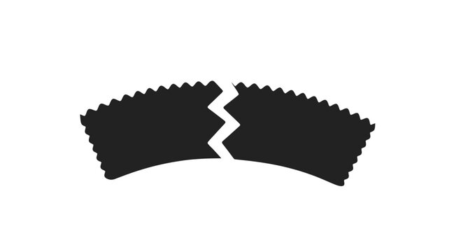 Broken black gear with jagged edges.