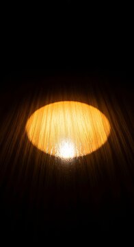 A soft glowing circle of golden light illuminates a polished wooden surface, creating a peaceful and secure sanctuary within the shadows, stillness, room, shelter