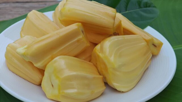 Jackfruit on a plate, peeled and ready to eat.	