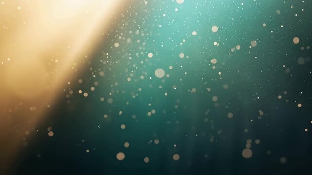 Teal and gold bokeh particles floating with warm light glow creating dreamy atmosphere