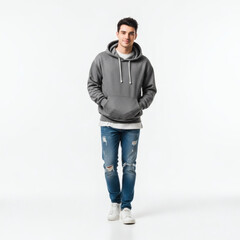 Naklejka premium A young man wearing a gray hoodie and ripped jeans standing confidently