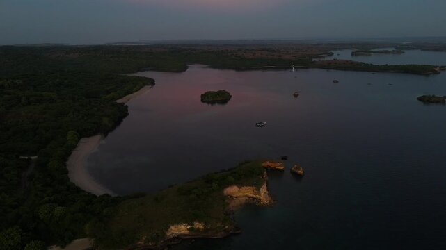 Aerial View of Tropical Coastline and Calm Bay at Dusk