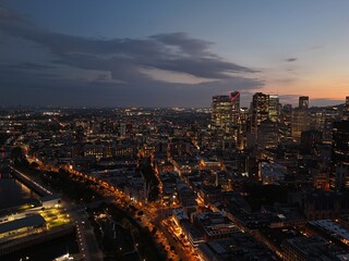 Obraz premium Montreal skyline at sunset with Old Port clock tower, marina and city lights reflecting on water. g.