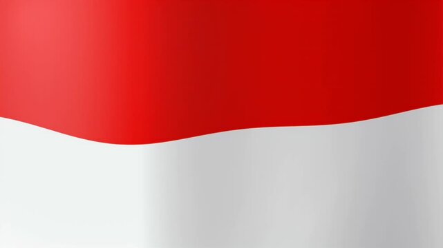 National flag of Indonesia waving in the wind with a smooth silk texture and vibrant red and white colors.