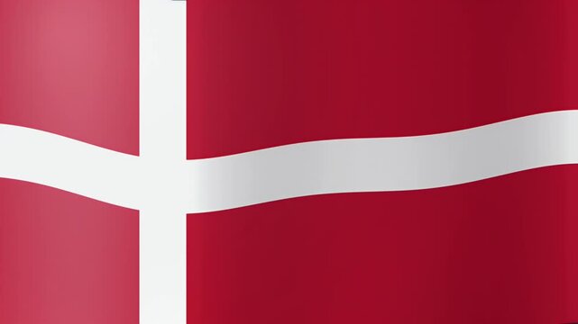 National flag of Denmark waving in the wind with its distinctive white cross over a vibrant red background.