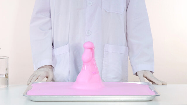 Pink Elephant Toothpaste Foam Erupting from Flask in Science Experiment