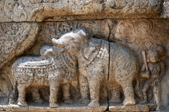 sculpture of a elephant and bull at hindu temple 