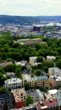 Vertical video. Oslo, Norway. Royal Palace. Slottsplassen. Palace park. Drone footage. Rich colors