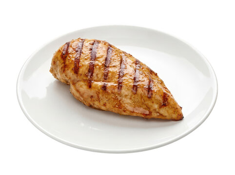 Succulent grilled chicken breast with visible grill marks on a white plate isolated transparent background image