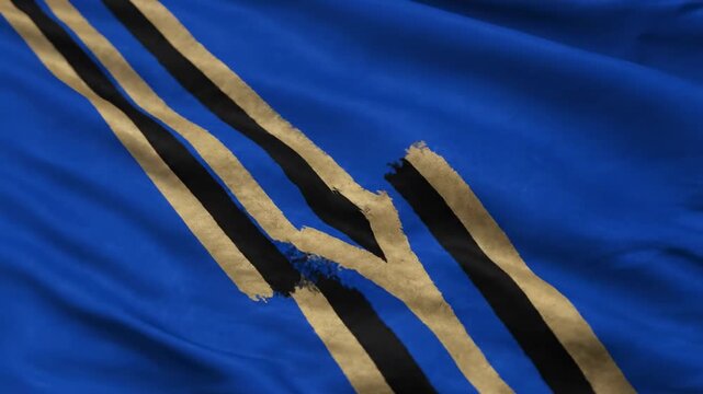 Blue fabric with ripped stripes, golden and black, waving gently