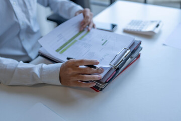 Fototapeta premium Businessman doing work reading documents