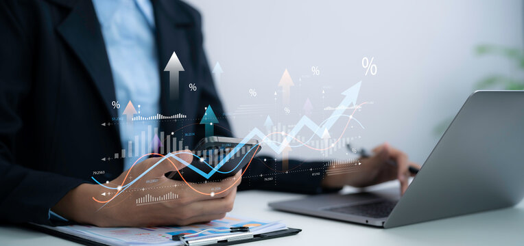 Business professional analyzes tax VAT data on smartphone and laptop in office using financial charts for accounting compliance reporting and digital finance management strategy