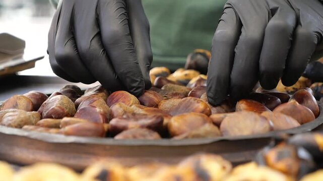 Chestnuts being roasted on open fire in a market