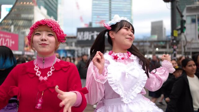 Two Young Women in Colorful Decora Fashion Dancing in Shibuya Tokyo