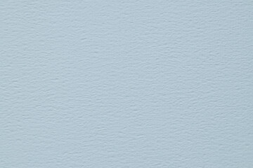 Naklejka premium Light blue textured paper surface with subtle grain pattern serving as a minimalist background