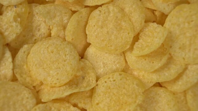 Rotating background texture of cereal flakes macro view close up breakfast food pattern