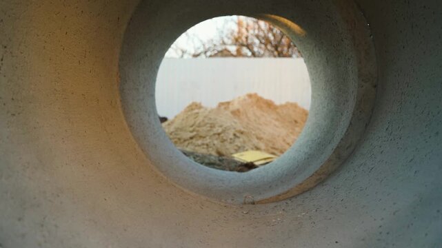 Smooth camera movement inside concrete ring at construction site