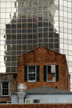 Historic Brick Building Against Reflected Glass Tower New Orleans CBD