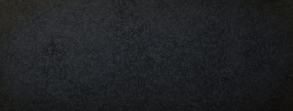 粗い粒状感のある黒い紙の背景テクスチャー
