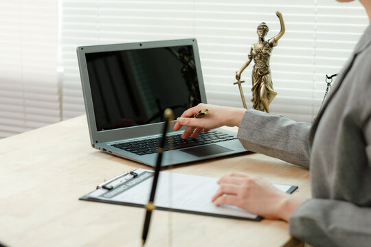 Hand holding a pen highlighting key terms and making corrections on a printed employment agreement, representing detailed vetting.