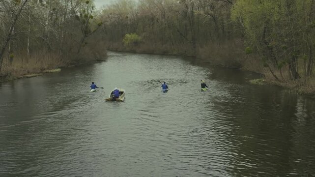Professional Coach Training Kayaker Group Before Competition.  Instructor Guiding Athletes During Rowing Practice