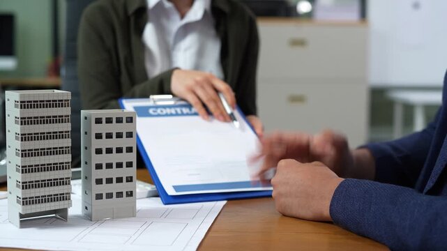 Considering buying a home, investing in real estate. Broker signs a sales agreement. agent, lease agreement, successful deal.