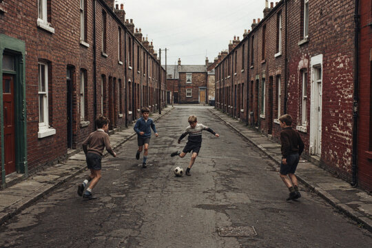 Nostalgic Scene of Young Boys Playing Street Football in a Vintage British Working Class Neighborhood