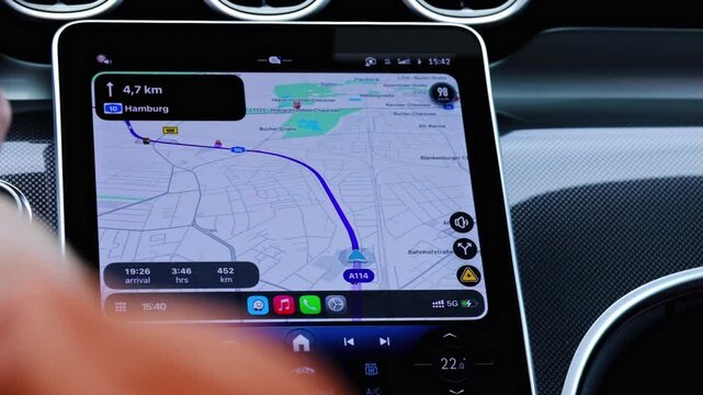 A navigation screen on a luxury car showing the route to Hamburg Germany