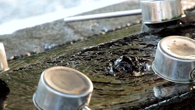 Traditional Japanese Water Purification Fountain at Oyama Shrine in Kanazawa