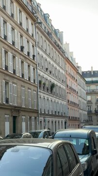 Tranquil boulevard featuring shuttered windows and balconies