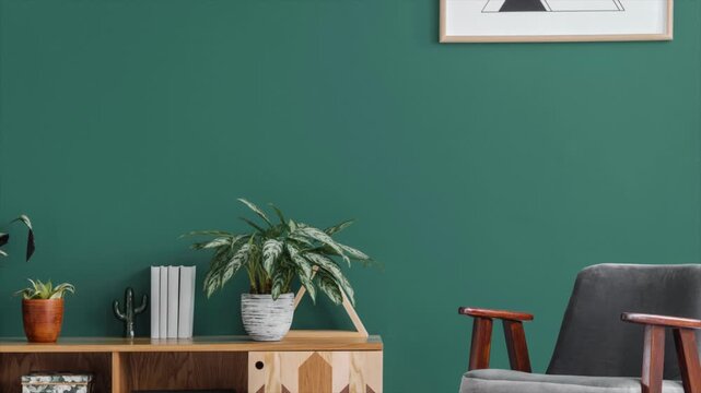 Minimal modern living room interior with green wall, wooden cabinet, houseplants and chair, cozy home decor background, clean aesthetic zoom out 4k scene