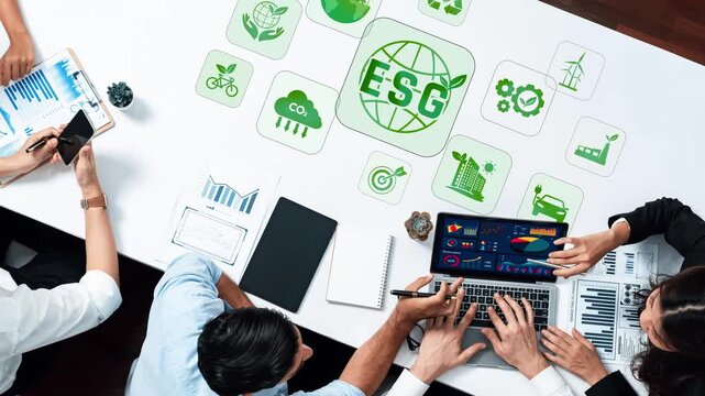 A diverse group of professionals engages in a business meeting focused on ESG principles, surrounded by graphs, charts, and various sustainability icons, emphasizing collaboration. Raster