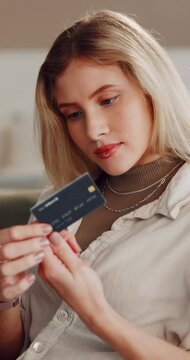 Woman, home and banking with credit card for online shopping, payment or wireless transaction. Female person, shopper or user with debit on sofa for ecommerce app, order or virtual purchase in house