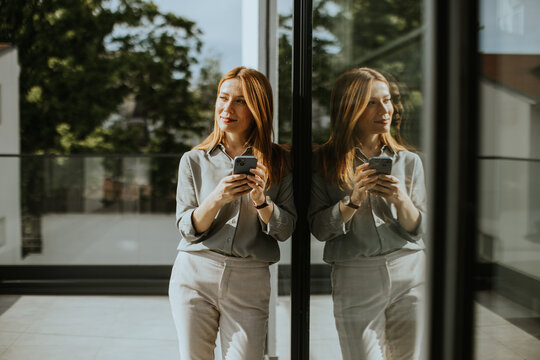 Reflective moments of a woman enjoying a sunny day in a modern setting