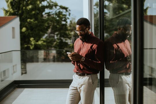 Thoughtful moment on a sunny balcony in the heart of the city