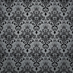 Fototapeta premium Wallpaper in the style of Baroque. Gray and black floral ornament. Seamless vector background. Graphic pattern for fabric, wallpaper, packaging. Ornate Damask flower illustration