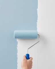 Obraz premium Interior Painting Project Photography Featuring a Close Up of a Paint Roller Applying Light Blue Paint to a Fresh White Wall 