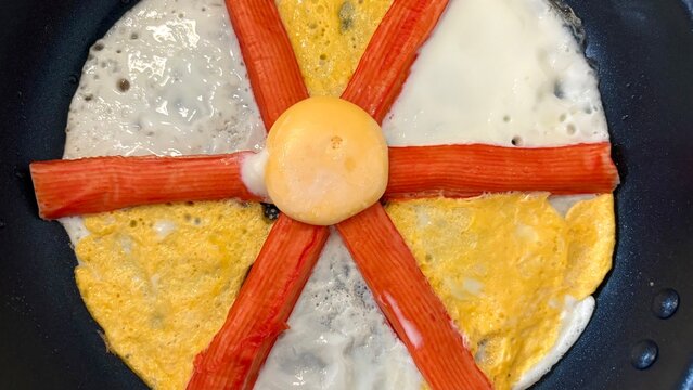 A beautiful of fried eggs and Crab sticks menu , in breakfast meal , food image.