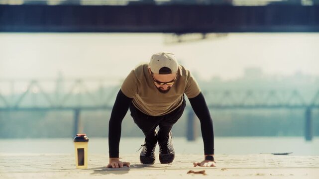 Pushups On City Embankment Near River. Performing Strength Training