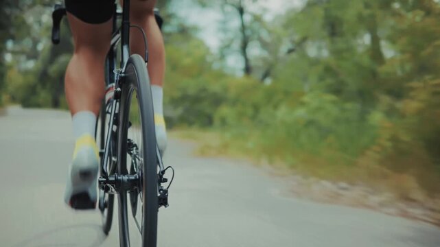Cyclist Riding Road Bike On Asphalt Path. Athlete Training For Competition
