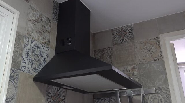 activating the different ventilation modes of the kitchen hood. High quality 4k footage