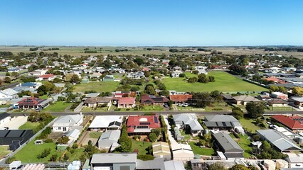 Fototapeta premium Millicent, South Australia: 4K aerial drone image of Rotunda Parklands, residential houses, estates, streets, traffic and regional town landscape