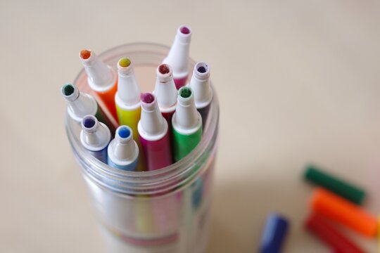 Close-up of Used Markers with Worn Tips from Overhead