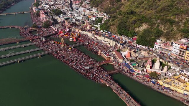 Static Aerial view of har ki pauri haridwar with massive pilgrim crowd for hindu festival.