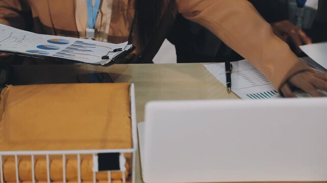 Business woman accountant working in office checking financial accounts and allocating company budgets.