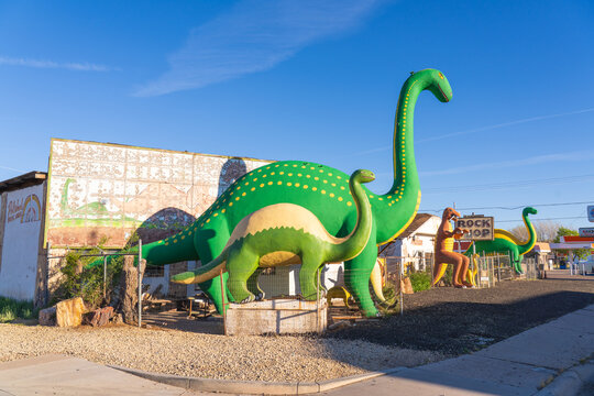 Holbrook, Arizona, USA - April 5th 2026: Dinos of Holbrook museum and shop, with large dinosaurs on the road side